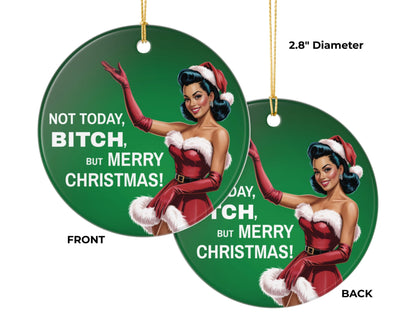 Christmas ornament with a woman in a Santa outfit and humorous text on a green background.