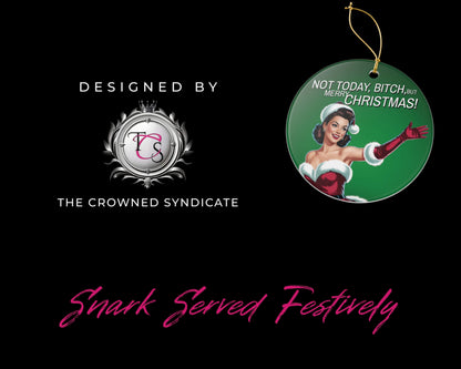 Decorative Christmas ornament with a design of a woman in a Santa hat and text, branded by The Crowned Syndicate on a black background.