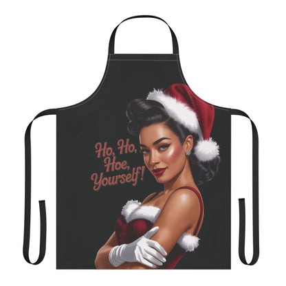 Black apron with a graphic of a woman wearing a Santa hat and text 'Ho, Ho, Hoe Yourself!' on a white background.