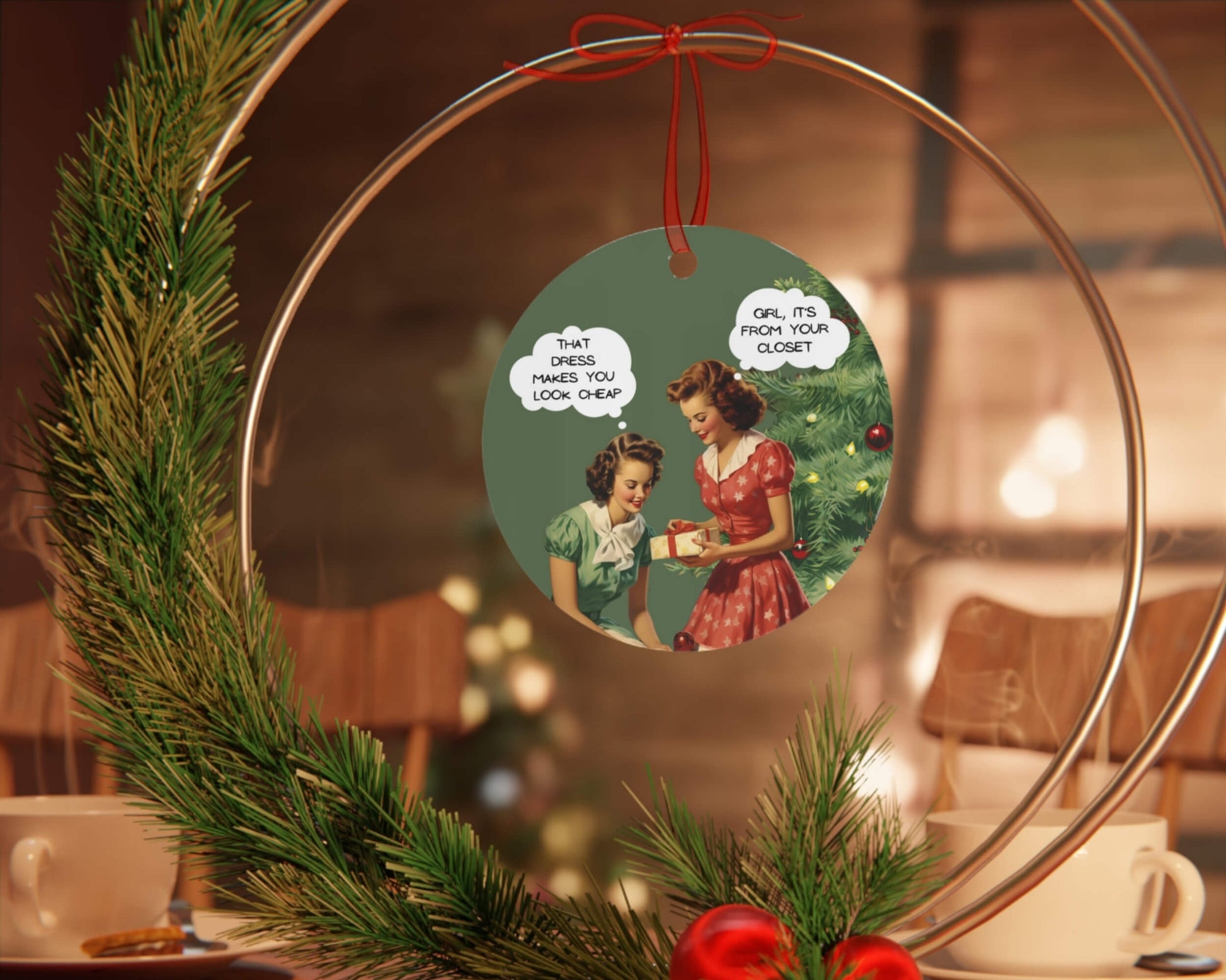 Decorative wreath with a vintage-style Christmas ornament featuring two women and a gift.