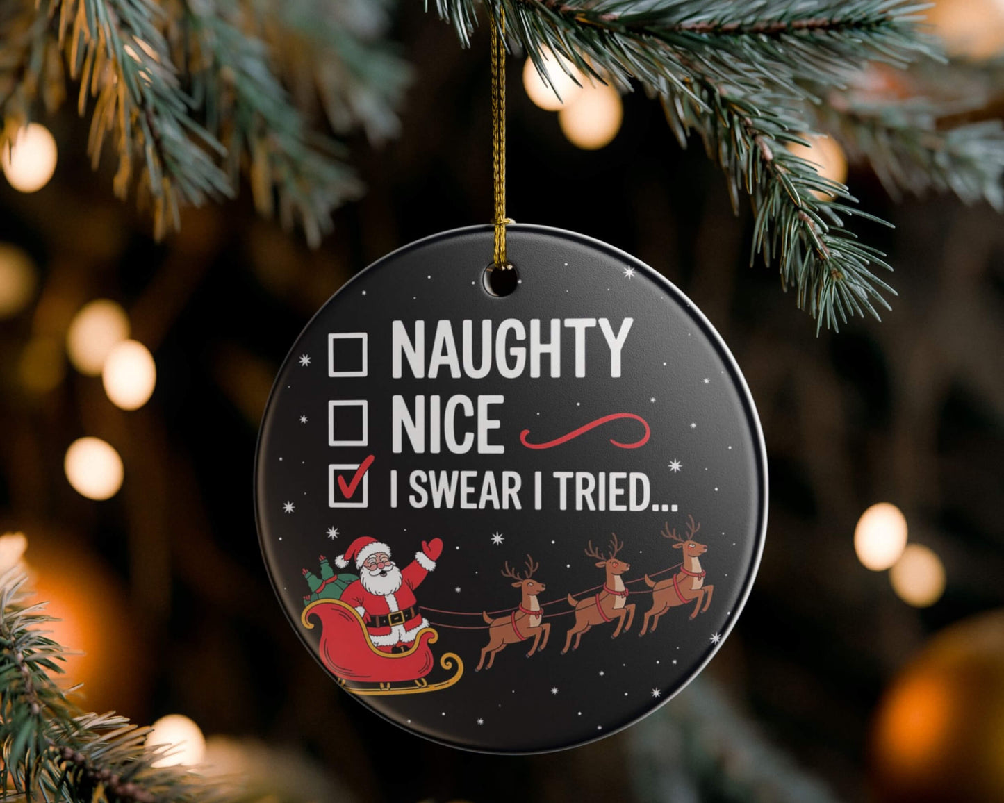 Decorative Christmas ornament with Santa Claus and reindeer on a tree.