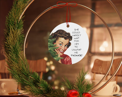 Decorative Christmas ornament with a vintage-style illustration and text, hanging on a wreath.