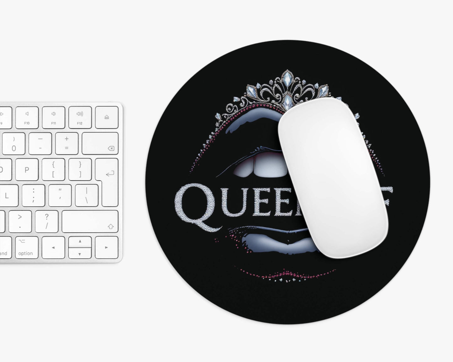 Mouse pad with 'QUEEN' design on a keyboard
