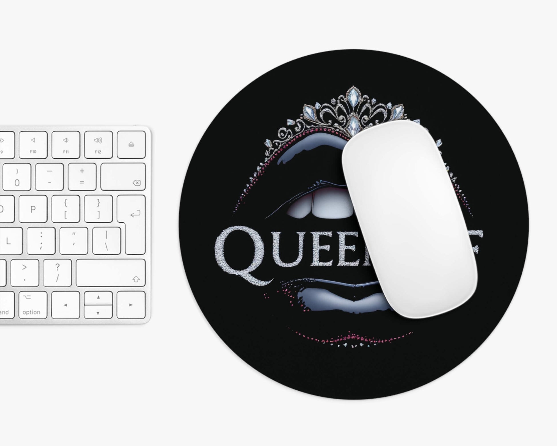Mouse pad with 'QUEEN' design on a keyboard