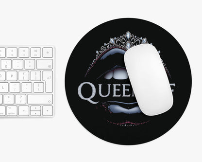 Mouse pad with 'QUEEN' design on a keyboard