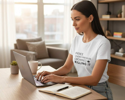 Woman working on a laptop in a home office setting