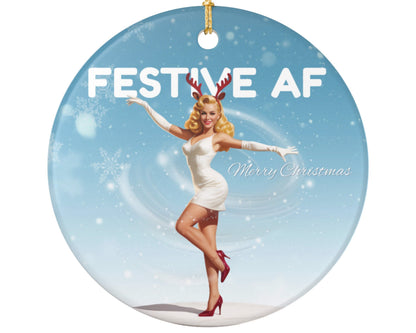 Christmas ornament with a woman in a white dress and red shoes, wearing reindeer antlers, against a snowy background with 'Festive AF' text.