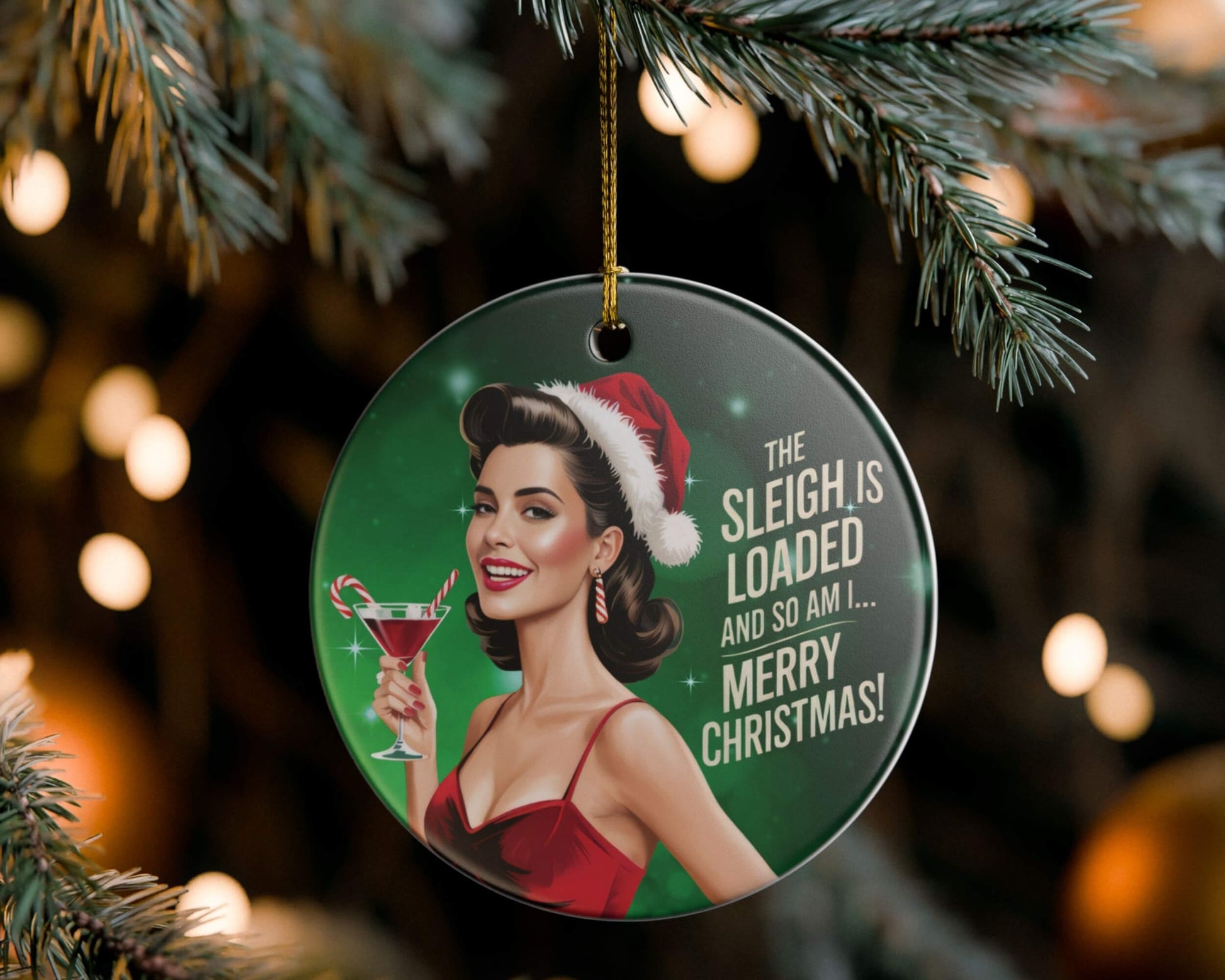 Christmas ornament with a woman in a red dress and Santa hat holding a martini, surrounded by festive lights.