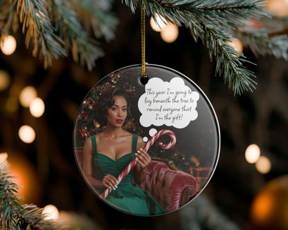 Decorative Christmas ornament with a woman in a green dress and candy canes, hanging on a tree.