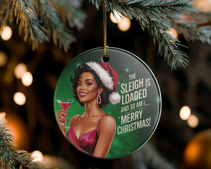 Christmas ornament with a woman in a Santa hat and martini glass, text 'The Sleigh is Loaded and So Am I.