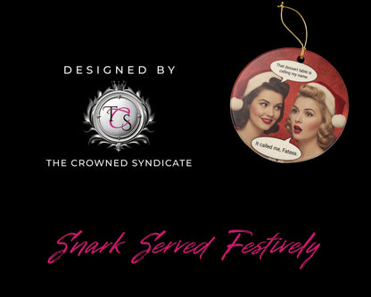 Decorative Christmas ornament with two women in Santa hats and text, branded by The Crowned Syndicate on a black background.