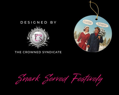 Decorative Christmas ornament with a couple in winter clothing, branded by The Crowned Syndicate on a black background.