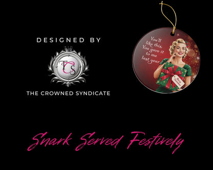 Decorative Christmas ornament with a woman in a green dress and red bow, featuring text and 'The Crowned Syndicate' branding.