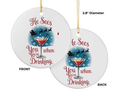 Christmas ornament with a cocktail graphic and text 'He sees you when you're drinking' on a white background.