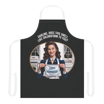 Black apron with a graphic of a woman holding a 'Happy Hanukkah' sign, text 'Darling, does this smell like chloroform to you?'.